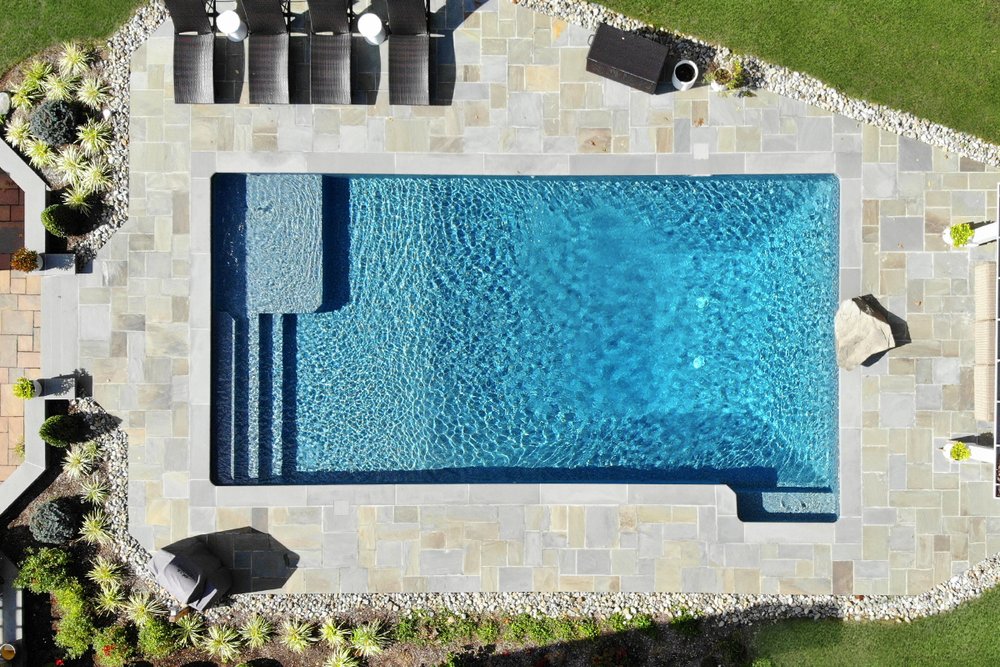 Rectangular pool with spa, patio, and lawn