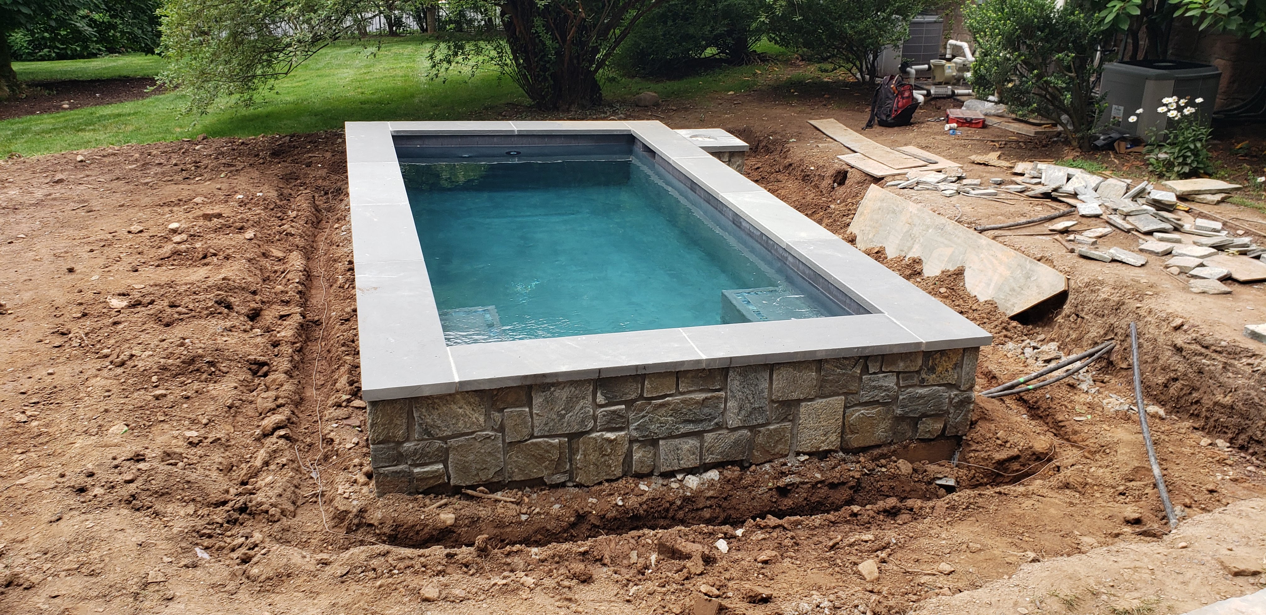 Residential pool with waterfall and landscaping