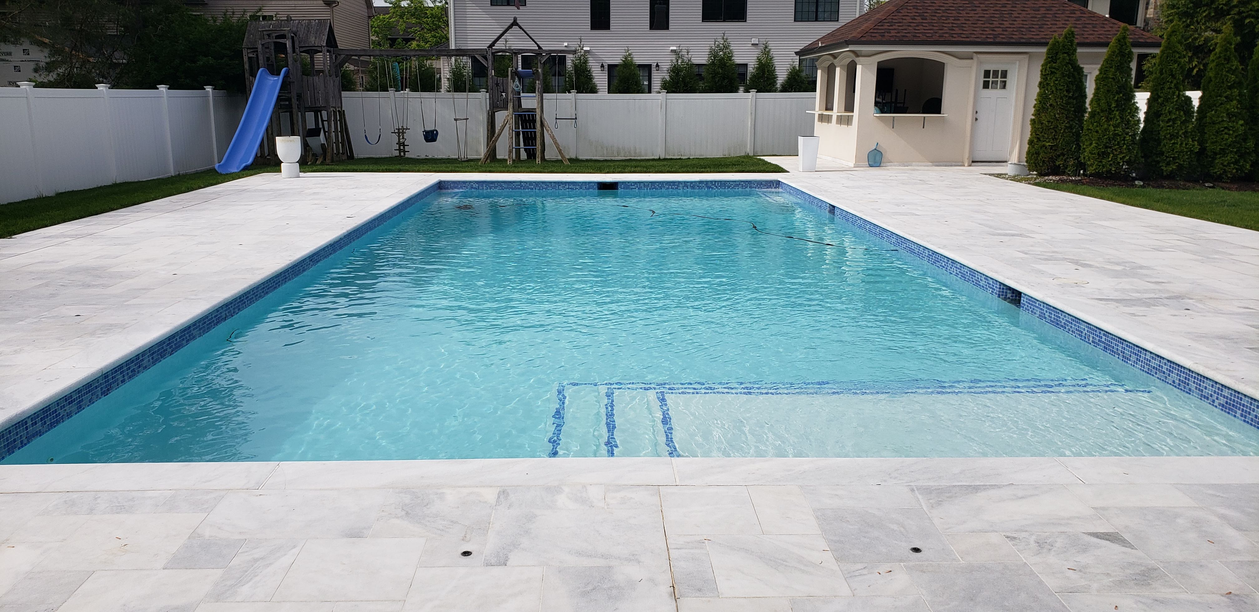 Pool with waterfall water feature